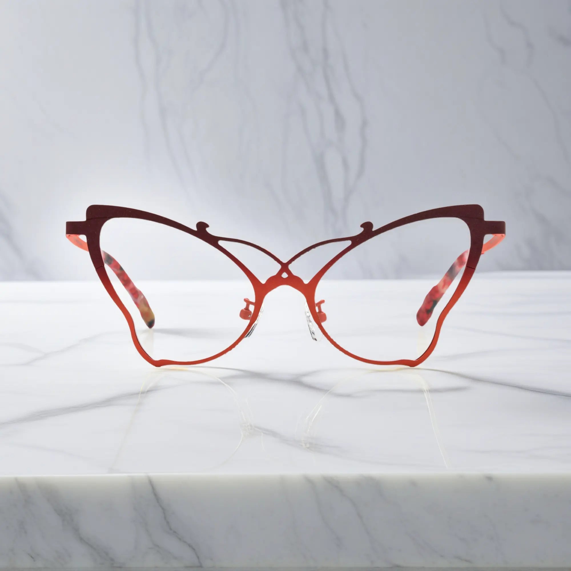 Front of VoyueLens™ VL185862 titanium butterfly eyeglasses in Amber Orange – a lightweight, colorful, vintage-inspired, prescription ready frame designed for unique artistic style and everyday comfort.